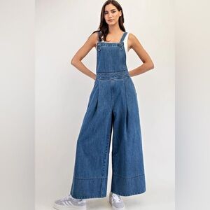 Brand new. Beautiful wide leg jumpsuit by Camellia. Size Large.